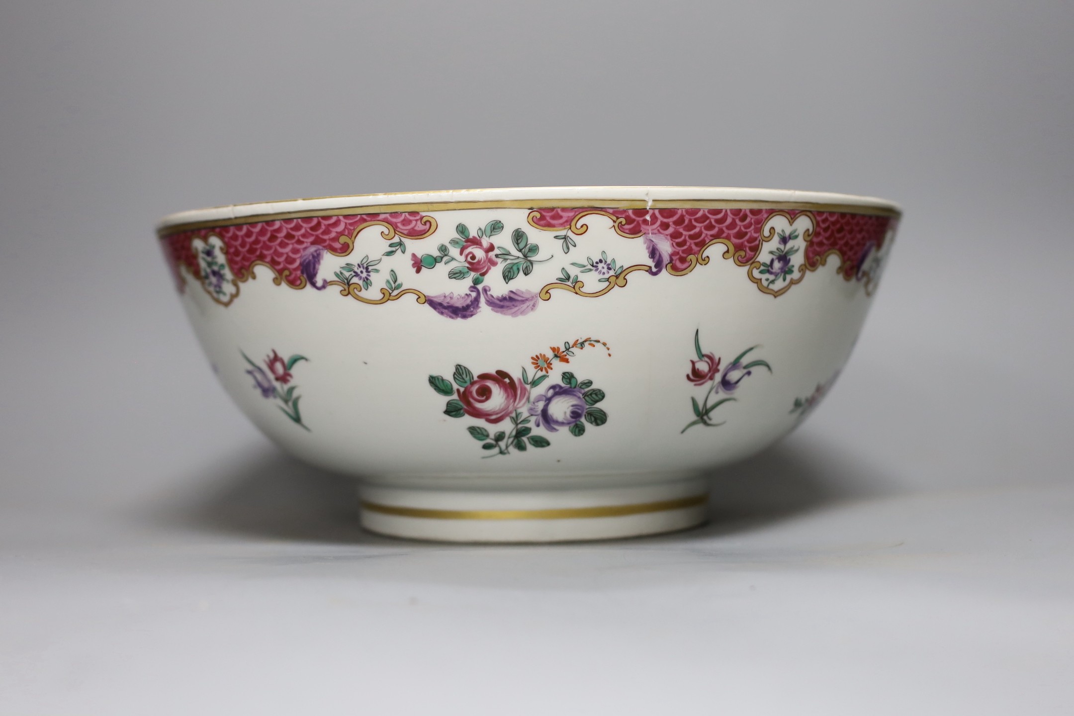A Sunderland pink lustre sailor's bowl, marked Scott(?), together with a Paris porcelain 'one bowl more and then' bowl, and a 18th century Chinese famille rose hot water pot, tallest 23cm (3)